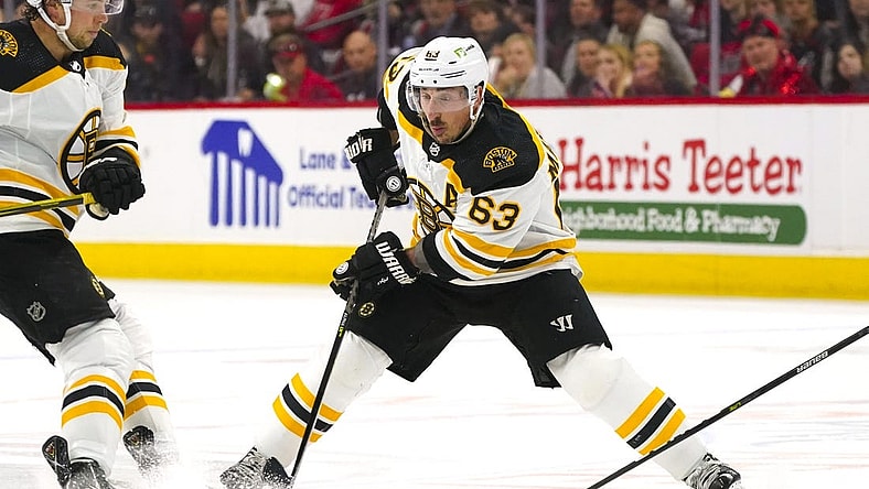 May 10, 2022; Raleigh, North Carolina, USA; Boston Bruins left wing Brad Marchand (63) skates with the puck against the Carolina Hurricanes during the second period in game five of the first round of the 2022 Stanley Cup Playoffs at PNC Arena. Mandatory Credit: James Guillory-USA TODAY Sports