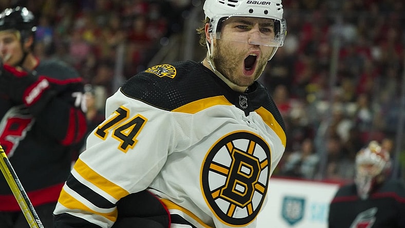 May 14, 2022; Raleigh, North Carolina, USA; Boston Bruins left wing Jake DeBrusk (74) celebrates his goal against the Carolina Hurricanes during the second period in game seven of the first round of the 2022 Stanley Cup Playoffs at PNC Arena. Mandatory Credit: James Guillory-USA TODAY Sports