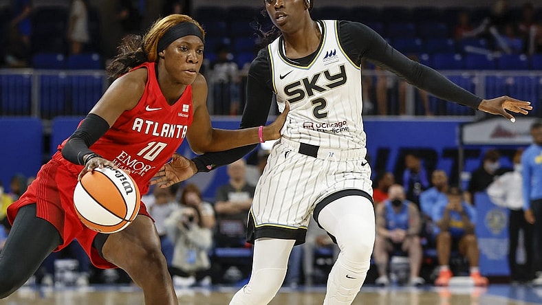 Jun 17, 2022; Chicago, Illinois, USA; Atlanta Dream guard Rhyne Howard (10) drives to the basket against Chicago Sky guard Kahleah Copper (2) during the first half of a WNBA game at Wintrust Arena. Mandatory Credit: Kamil Krzaczynski-USA TODAY Sports