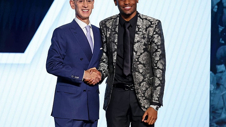 Jun 23, 2022; Brooklyn, NY, USA; Malaki Branham (Ohio State) shakes hands with NBA commissioner Adam Silver after being selected as the number twenty overall pick by the San Antonio Spurs in the first round of the 2022 NBA Draft at Barclays Center. Mandatory Credit: Brad Penner-USA TODAY Sports