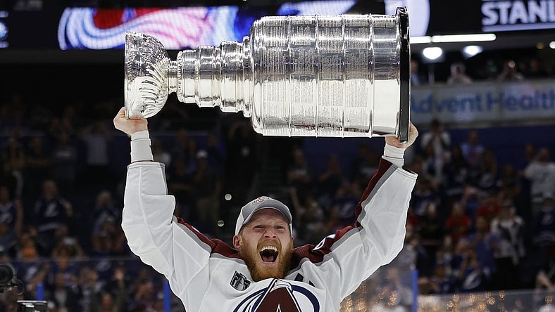 Jun 26, 2022; Tampa, Florida, USA; Colorado Avalanche left wing Gabriel Landeskog (92) celebrates with the Stanley Cup after the game against the Tampa Bay Lightning in game six of the 2022 Stanley Cup Final at Amalie Arena. Mandatory Credit: Geoff Burke-USA TODAY Sports