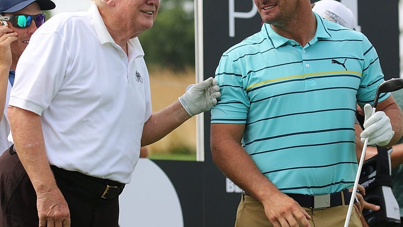 July 28, 2022; Bedminster, NJ, USA; Donald Trump with Bryson DeChambeau during the Pro Am. The LIV Pro Am Tournament featured the former President of the United States, Donald Trump and his son Eric Trump playing with with Dustin Johnson and Bryson DeChambeau at Trump National in Bedminster, NJ on July 28, 2022. Mandatory Credit: Chris Pedota-USA TODAY NETWORK