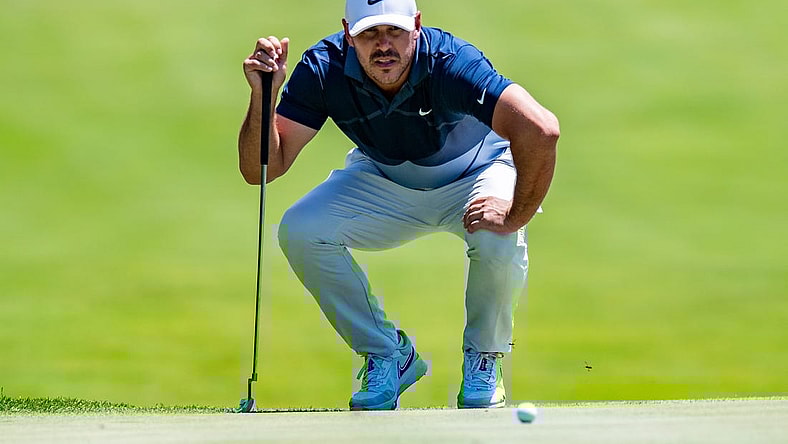 Jul 30, 2022; Bedminster, New Jersey, USA; Brooks Koepka lines up a putt on the 3rd green during the second round of a LIV Golf tournament at Trump National Golf Club Bedminster. Mandatory Credit: John Jones-USA TODAY Sports