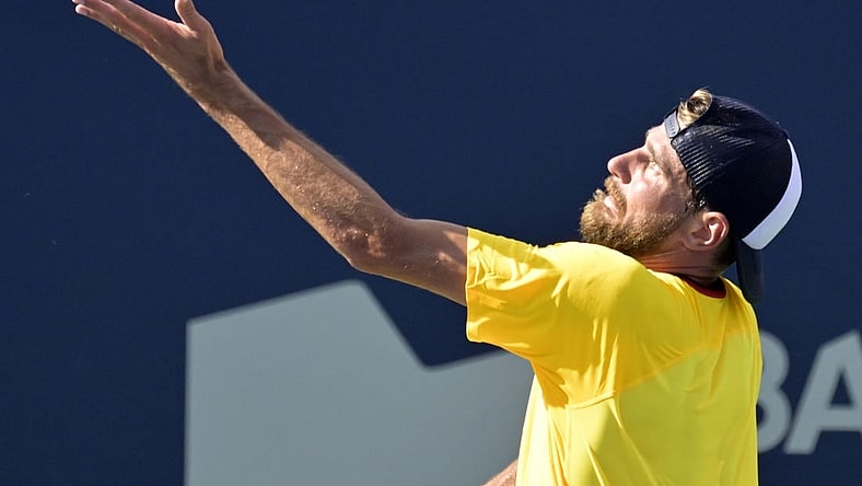 Aug 10, 2022; Montreal, QC, Canada; Maxime Cressy (USA) serves against Gael Monfils (FRA) (not pictured) in second round play at IGA Stadium. Mandatory Credit: Eric Bolte-USA TODAY Sports