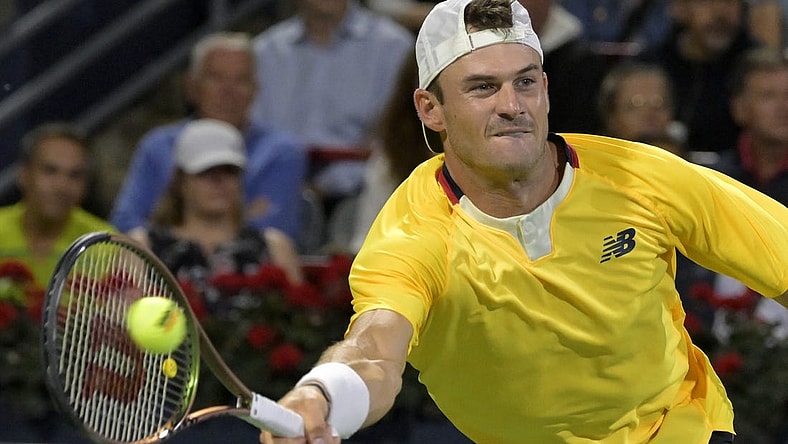 Aug 12, 2022; Montreal, QC, Canada; Tommy Paul (USA) hits a forehand against Daniel Evans (GBR) (not pictured) in quarterfinal play in the National Bank Open at IGA Stadium. Mandatory Credit: Eric Bolte-USA TODAY Sports