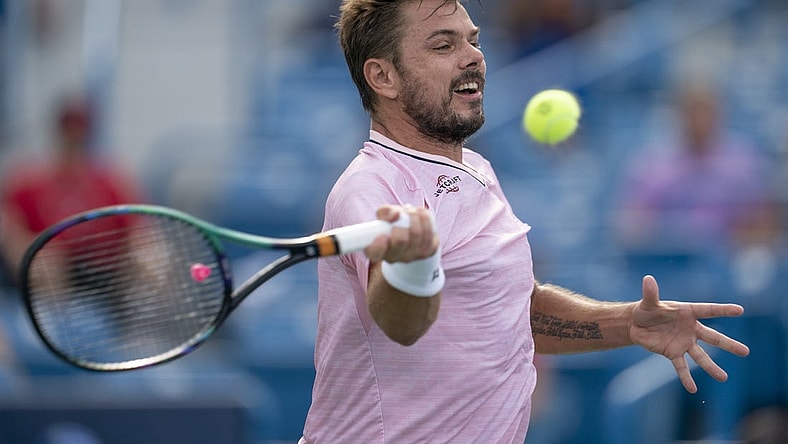 Aug 15, 2022; Cincinnati, OH, USA;  Stanislas Wawrinka (SUI) returns a shot during his match against Andy Murray (GBR) at the Western & Southern at the at the Lindner Family Tennis Center. Mandatory Credit: Susan Mullane-USA TODAY Sports