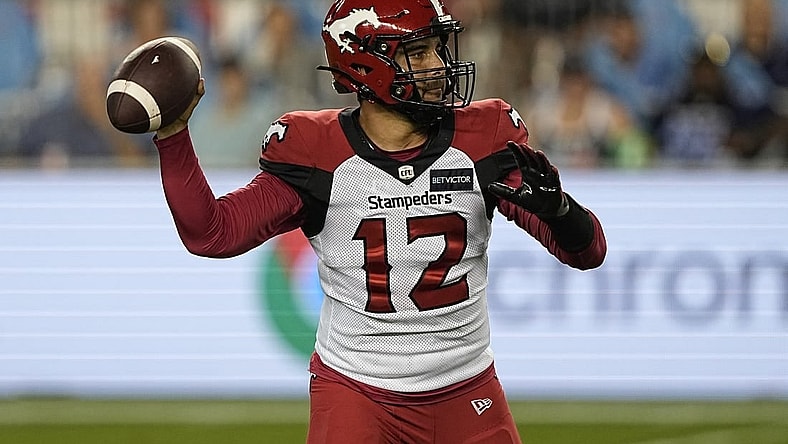 Aug 20, 2022; Toronto, Ontario, CAN; Calgary Stampeders quarterback Jake Maier (12) throws against the Toronto Argonauts during the second half at BMO Field. Mandatory Credit: John E. Sokolowski-USA TODAY Sports