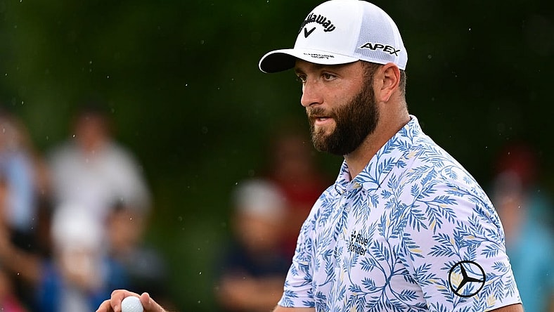 Aug 25, 2022; Atlanta, Georgia, USA; Jon Rahm waves to the gallery after a putt on the 1st green during the first round of the TOUR Championship golf tournament. Mandatory Credit: Adam Hagy-USA TODAY Sports