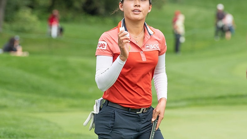 Aug 26, 2022; Ottawa, Ontario, CAN; Atthaya Thitikul from Thailand completes her 18th hole during the second round of the CP Women's Open golf tournament. Mandatory Credit: Marc DesRosiers-USA TODAY Sports