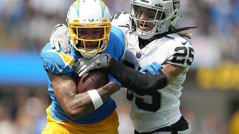 Sep 11, 2022; Inglewood, California, USA; Los Angeles Chargers wide receiver Keenan Allen (13) and Las Vegas Raiders safety Tre'von Moehrig (25) in the first half at SoFi Stadium. Mandatory Credit: Kirby Lee-USA TODAY Sports