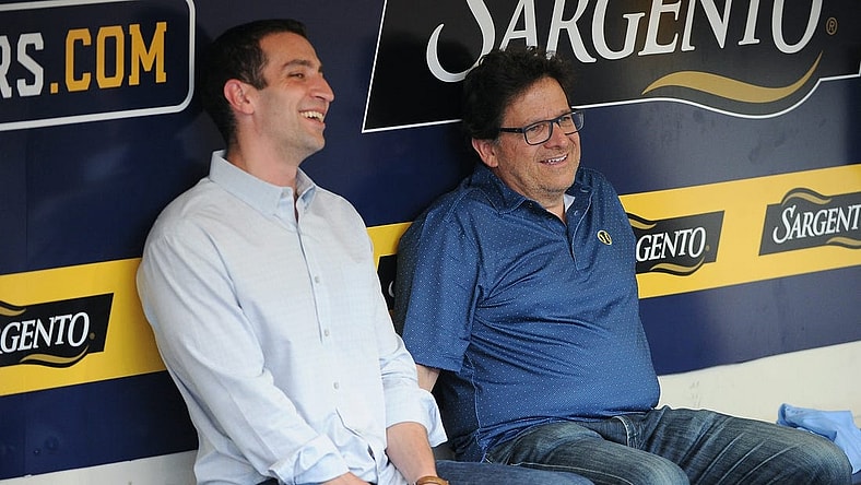 Sep 17, 2022; Milwaukee, Wisconsin, USA;  Milwaukee Brewers Baseball Operations and General Manager David Stearns and Milwaukee Brewers Owner Mark Attanasio share a laugh while talking in the dugout before their game against the New York Yankees at American Family Field. Mandatory Credit: Michael McLoone-USA TODAY Sports