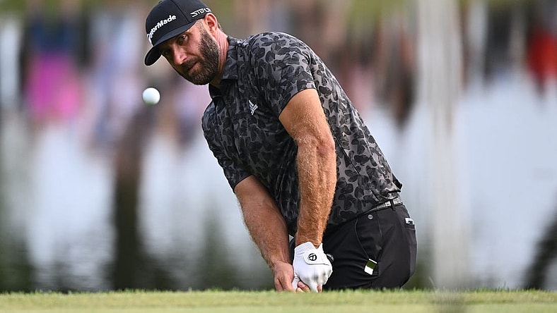 Sep 17, 2022; Chicago, Illinois, USA; Dustin Johnson chips onto the 17th green during the second round of the Invitational Chicago LIV Golf tournament at Rich Harvest Farms. Mandatory Credit: Jamie Sabau-USA TODAY Sports