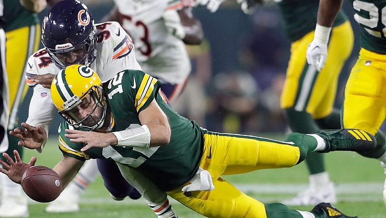 Green Bay Packers quarterback Aaron Rodgers (12) and Chicago Bears linebacker Robert Quinn (94) dive for a loose ball in the second half of their football game on Sunday, September 18, 2022 at Lambeau Field. in Green Bay, Wis. Wm. Glasheen USA TODAY NETWORK-Wisconsin
Apc Pack Vs Bears 4204 091822wag