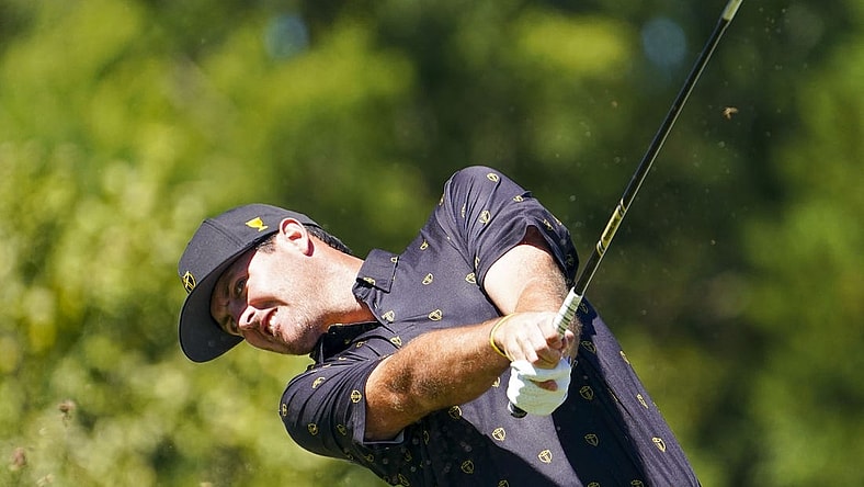 Sep 23, 2022; Charlotte, North Carolina, USA; International Team golfer Mito Pereira celebrates hits his tee shot on the fourth hole during the four-ball match play of the Presidents Cup golf tournament at Quail Hollow Club. Mandatory Credit: Peter Casey-USA TODAY Sports