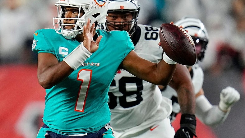 Miami Dolphins quarterback Tua Tagovailoa (1) is pursued by Cincinnati Bengals defensive tackle Josh Tupou (68) in the second quarter of the NFL Week 4 game between the Cincinnati Bengals and the Miami Dolphins at PayCor Stadium in downtown on Thursday, Sept. 29, 2022. The Bengals 14-12 at halftime.

Miami Dolphins At Cincinnati Bengals Week 4