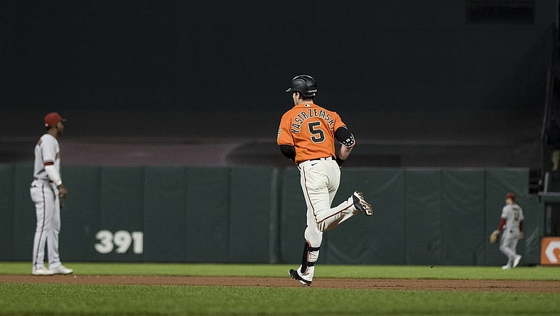 Sep 30, 2022; San Francisco, California, USA; San Francisco Giants right fielder Mike Yastrzemski (5) runs the bases after hitting a solo home run against the Arizona Diamondbacks during the fourth inning at Oracle Park. Mandatory Credit: John Hefti-USA TODAY Sports