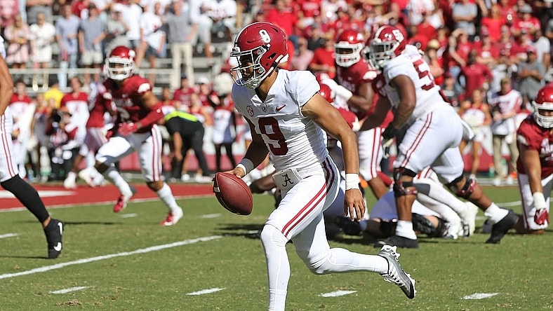Oct 1, 2022; Fayetteville, Arkansas, USA; Alabama Crimson Tide quarterback Bryce Young (9) rushes for a touchdown in the first quarter against the Arkansas Razorbacks at Donald W. Reynolds Razorback Stadium. Mandatory Credit: Nelson Chenault-USA TODAY Sports