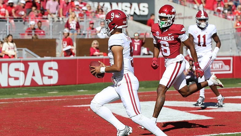 Oct 1, 2022; Fayetteville, Arkansas, USA; Alabama Crimson Tide quarterback Bryce Young (9) rushes for a touchdown in the first quarter against the Arkansas Razorbacks at Donald W. Reynolds Razorback Stadium. Mandatory Credit: Nelson Chenault-USA TODAY Sports