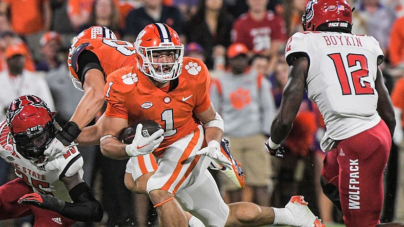 Clemson running back Will Shipley (1) runs near NC State defensive back Devan Boykin (12) during the first quarter at Memorial Stadium in Clemson, South Carolina Saturday, October 1, 2022.

Ncaa Football Clemson Football Vs Nc State Wolfpack