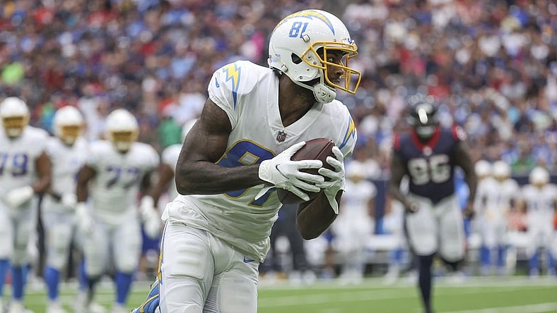 Oct 2, 2022; Houston, Texas, USA; Los Angeles Chargers wide receiver Mike Williams (81) runs with the ball after a reception during the second quarter against the Houston Texans at NRG Stadium. Mandatory Credit: Troy Taormina-USA TODAY Sports