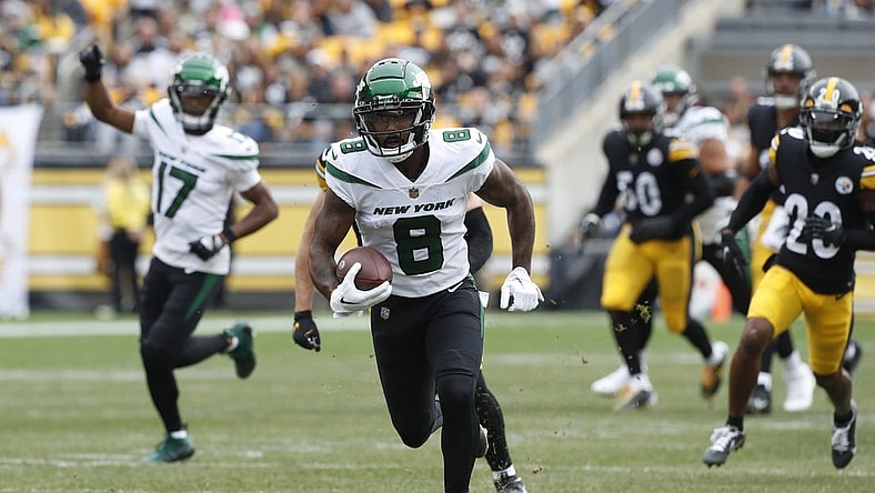 Oct 2, 2022; Pittsburgh, Pennsylvania, USA;  New York Jets wide receiver Elijah Moore (8) runs after a catch against the Pittsburgh Steelers during the first quarter at Acrisure Stadium. Mandatory Credit: Charles LeClaire-USA TODAY Sports