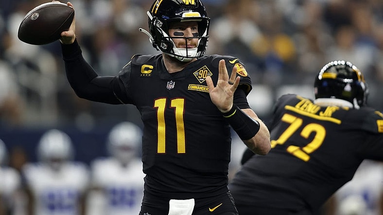 Oct 2, 2022; Arlington, Texas, USA; Washington Commanders quarterback Carson Wentz (11) throws a pass in the second quarter against the Dallas Cowboys at AT&T Stadium. Mandatory Credit: Tim Heitman-USA TODAY Sports