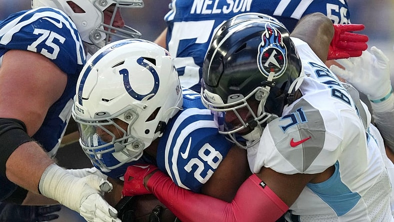 Oct 2, 2022; Indianapolis, Indiana, USA; Tennessee Titans safety Kevin Byard (31) works to bring down Indianapolis Colts running back Jonathan Taylor (28) during the first half at Lucas Oil Stadium. Mandatory Credit: Jenna Watson/IndyStar-USA TODAY NETWORK