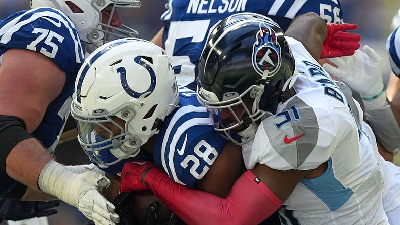 Tennessee Titans safety Kevin Byard (31) works to bring down Indianapolis Colts running back Jonathan Taylor (28) on Sunday, Oct. 2, 2022, during a game against the Tennessee Titans at Lucas Oil Stadium in Indianapolis.