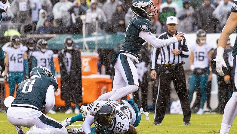 Oct 2, 2022; Philadelphia, Pennsylvania, USA; Philadelphia Eagles place kicker Jake Elliott (4) is run into by Jacksonville Jaguars cornerback Tyson Campbell (32) while attempting a field goal during the third quarter at Lincoln Financial Field. Mandatory Credit: Bill Streicher-USA TODAY Sports
