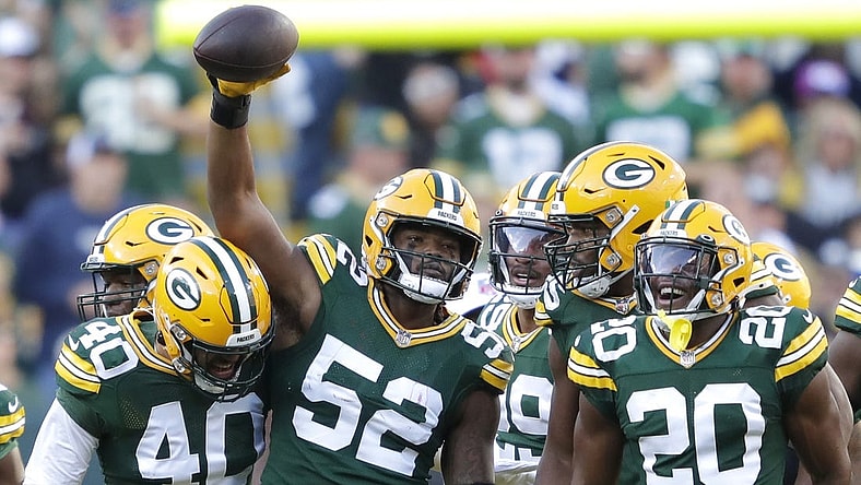 Oct 2, 2022; Green Bay, Wisconsin, USA; Green Bay Packers linebacker Rashan Gary (52) celebrates with teammates after sacking New England Patriots quarterback Bailey Zappe (not pictured) during the first half at Lambeau Field. Mandatory Credit: Dan Powers/Appleton Post-Crescent-USA TODAY NETWORK-Wisconsin