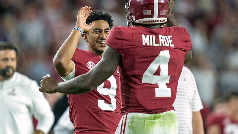 Oct 8, 2022; Tuscaloosa, Alabama, USA; Alabama Crimson Tide quarterback Jalen Milroe (4) celebrates with quarterback Bryce Young (9) after scoring a touchdown against the Texas A&M Aggies during the first half at Bryant-Denny Stadium. Mandatory Credit: Marvin Gentry-USA TODAY Sports
