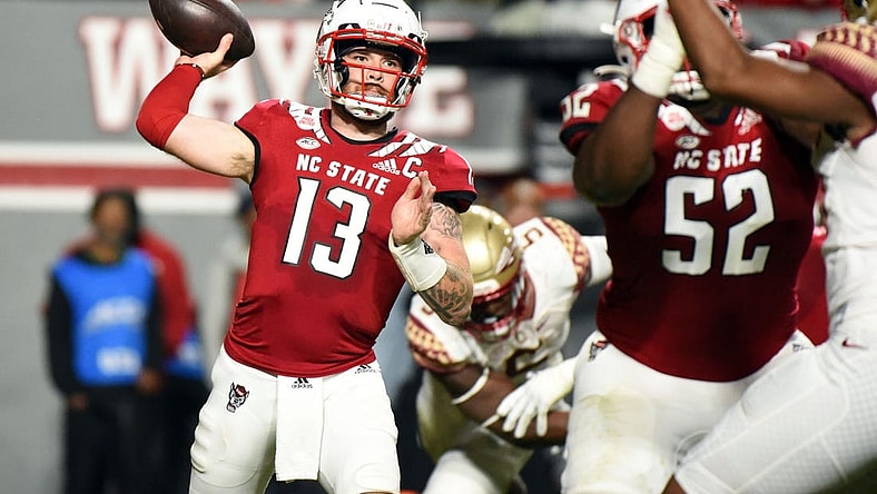 Oct 8, 2022; Raleigh, North Carolina, USA; North Carolina State Wolfpack quarterback Devin Leary (13) throws a pass during the first half against the Florida State Seminoles at Carter-Finley Stadium. Mandatory Credit: Rob Kinnan-USA TODAY Sports