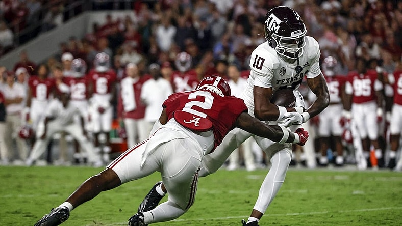 Oct 8, 2022; Tuscaloosa, Alabama, USA;  Texas A&M Aggies wide receiver Chris Marshall (10) catches a pass against Alabama Crimson Tide defensive back DeMarcco Hellams (2) at Bryant-Denny Stadium. Mandatory Credit: Butch Dill-USA TODAY Sports