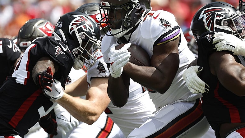 Oct 9, 2022; Tampa, Florida, USA; Tampa Bay Buccaneers running back Leonard Fournette (7) runs with the ball against the Atlanta Falcons during the first quarter at Raymond James Stadium. Mandatory Credit: Kim Klement-USA TODAY Sports