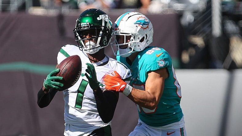 Oct 9, 2022; East Rutherford, New Jersey, USA; New York Jets cornerback Sauce Gardner (1) intercepts a pass intended for wide receiver River Cracraft (85) from quarterback Skylar Thompson (not shown) during the first half at MetLife Stadium. Mandatory Credit: Ed Mulholland-USA TODAY Sports