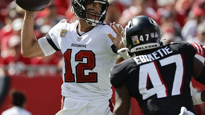 Oct 9, 2022; Tampa, Florida, USA; Tampa Bay Buccaneers quarterback Tom Brady (12) throws the ball against the Atlanta Falcons during the second half at Raymond James Stadium. Mandatory Credit: Kim Klement-USA TODAY Sports