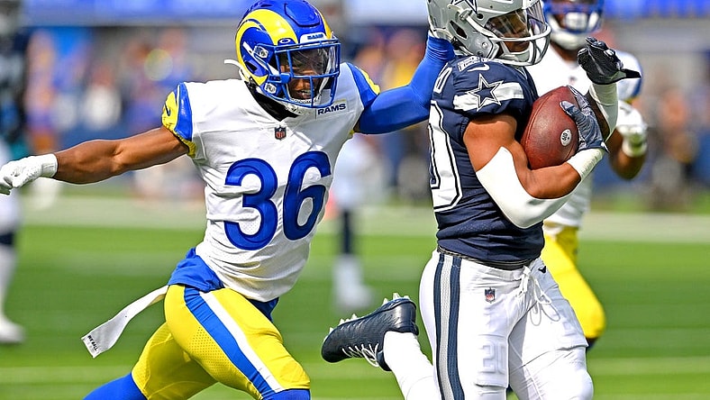 Oct 9, 2022; Inglewood, California, USA; Dallas Cowboys running back Tony Pollard (20) breaks away from Los Angeles Rams cornerback Grant Haley (36) for a touchdown run in the first half at SoFi Stadium. Mandatory Credit: Jayne Kamin-Oncea-USA TODAY Sports