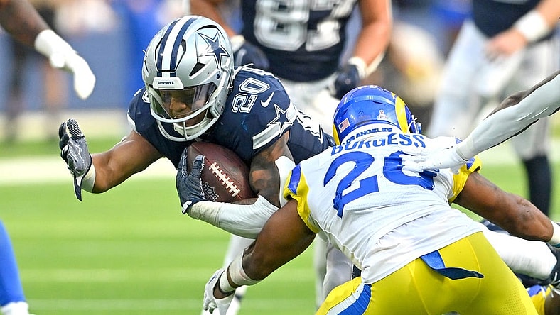 Oct 9, 2022; Inglewood, California, USA; Dallas Cowboys running back Tony Pollard (20) is stopped by Los Angeles Rams safety Terrell Burgess (26) after a short gain in the second half at SoFi Stadium. Mandatory Credit: Jayne Kamin-Oncea-USA TODAY Sports