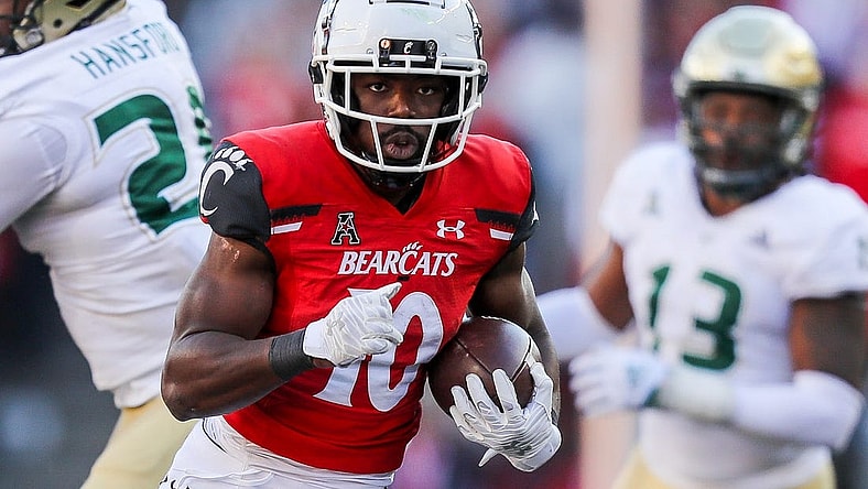 Oct 8, 2022; Cincinnati, Ohio, USA; Cincinnati Bearcats running back Charles McClelland (10) runs with the ball against the South Florida Bulls in the second half at Nippert Stadium. Mandatory Credit: Katie Stratman-USA TODAY Sports