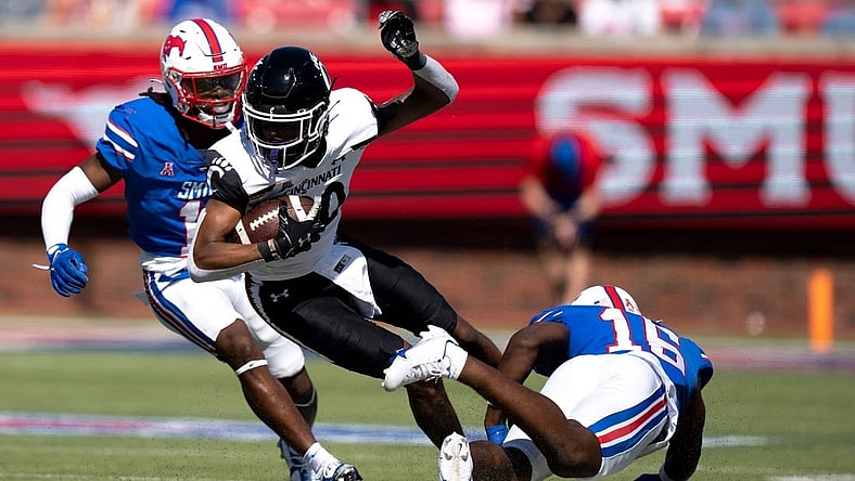 Cincinnati Bearcats wide receiver Jadon Thompson (20) is tackled by Southern Methodist Mustangs safety Ahmaad Moses (16) in the second quarter of the American Athletic Conference game between the Cincinnati Bearcats and the Southern Methodist Mustangs at Gerald J. Ford Stadium in Dallas on Saturday, Oct. 22, 2022.

Cincinnati Bearcats At Southern Methodist Mustangs 463