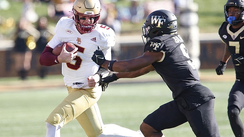 Oct 22, 2022; Winston-Salem, North Carolina, USA; Wake Forest Demon Deacons defensive back Chelen Garnes (9) moves in against Boston College Eagles quarterback Phil Jurkovec (5) out of bounds an a quarterback keeper  during the first quarter at Truist Field. Mandatory Credit: Reinhold Matay-USA TODAY Sports