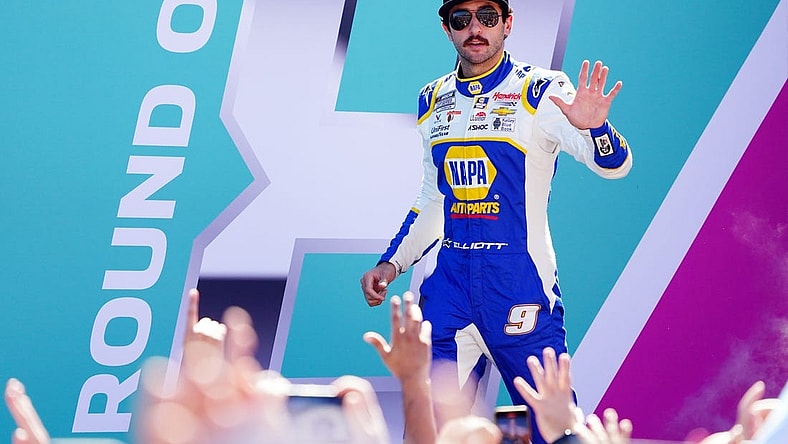 Oct 23, 2022; Homestead, Florida, USA; NASCAR Cup Series driver Chase Elliott (9) waves to the race fans along the front stretch before the Dixie Vodka 400 at Homestead-Miami Speedway. Mandatory Credit: John David Mercer-USA TODAY Sports