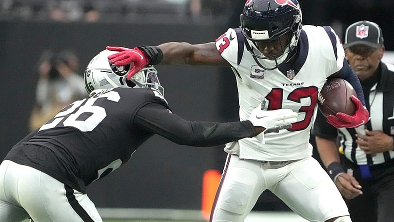 Oct 23, 2022; Paradise, Nevada, USA; Houston Texans wide receiver Brandin Cooks (13) is pursued by Las Vegas Raiders cornerback Rock Ya-Sin (26) in the first half at Allegiant Stadium. Mandatory Credit: Kirby Lee-USA TODAY Sports