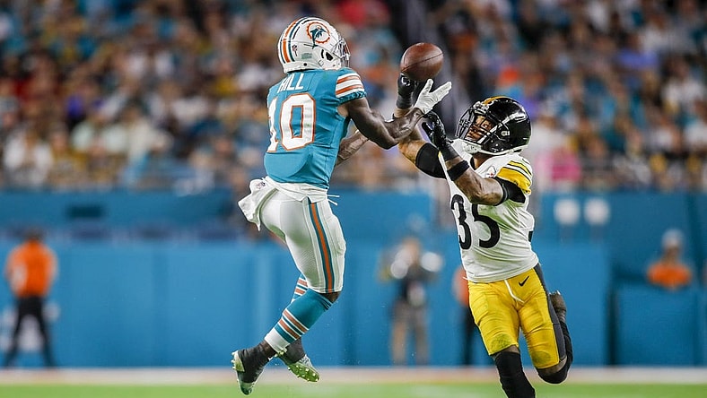 Oct 23, 2022; Miami Gardens, Florida, USA; Miami Dolphins wide receiver Tyreek Hill (10) catches the football over Pittsburgh Steelers cornerback Arthur Maulet (35) during the second quarter at Hard Rock Stadium. Mandatory Credit: Sam Navarro-USA TODAY Sports