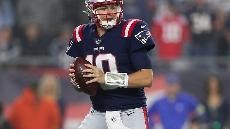 Oct 24, 2022; Foxborough, Massachusetts, USA; New England Patriots quarterback Mac Jones (10) drops back to pass during the first half against the Chicago Bears at Gillette Stadium. Mandatory Credit: Paul Rutherford-USA TODAY Sports