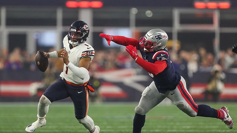 Oct 24, 2022; Foxborough, Massachusetts, USA; New England Patriots outside linebacker Matt Judon (9) chase down Chicago Bears quarterback Justin Fields (1) during the first half at Gillette Stadium. Mandatory Credit: Paul Rutherford-USA TODAY Sports
