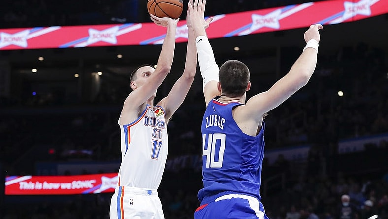 Oct 27, 2022; Oklahoma City, Oklahoma, USA; Oklahoma City Thunder forward Aleksej Pokusevski (17) shoots as LA Clippers center Ivica Zubac (40) defends the shot during the first half at Paycom Center. Mandatory Credit: Alonzo Adams-USA TODAY Sports