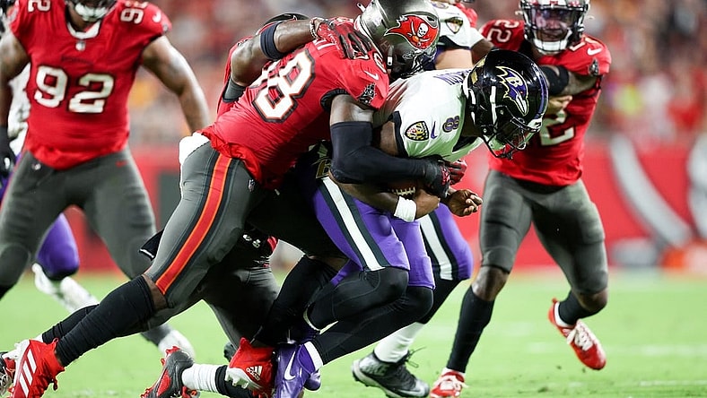 Oct 27, 2022; Tampa, Florida, USA;  Tampa Bay Buccaneers linebacker Shaquil Barrett (58) sacks Baltimore Ravens quarterback Lamar Jackson (8) in the second quarter at Raymond James Stadium. Mandatory Credit: Nathan Ray Seebeck-USA TODAY Sports