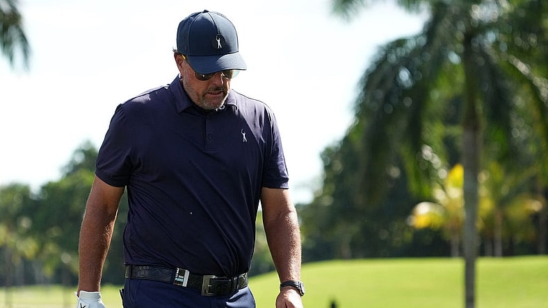 Oct 28, 2022; Miami, Florida, USA; Phil Mickelson walks down the fairway of the second hole during the first round of the season finale of the LIV Golf series at Trump National Doral. Mandatory Credit: Jasen Vinlove-USA TODAY Sports