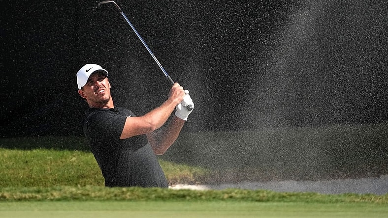 Oct 29, 2022; Miami, Florida, USA; Brooks Koepka plays his shot from the bunker on the 16th hole during the second round of the season finale of the LIV Golf series at Trump National Doral. Mandatory Credit: Jasen Vinlove-USA TODAY Sports